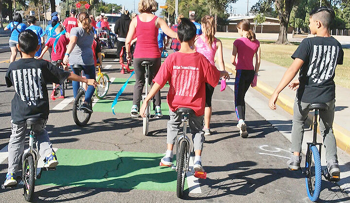 Riding unicycles in the 2018 Fourth of July Parade